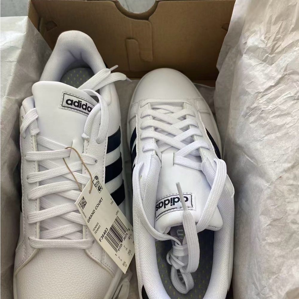 Adidas women’s  White Sneakers with Black Stripes